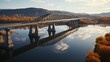Photo Of A Railway Bridge Over The Lake In Autumn 
