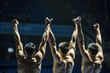 Athletes raising arms in a victory pose
