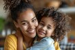 © top images - A woman and a child are hugging each other, both smiling