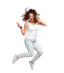 Wall Mural - Full length portrait of a joyful young woman jumping and celebrating over transparent  background.