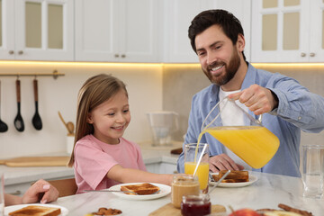 Sticker - Happy family having breakfast at table in kitchen