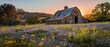 The sun casts a golden hue over a field of wildflowers leading to an old, rustic barn, embodying the essence of tranquil country life at sunset..