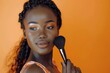 Portrait of african american woman with clean healthy skin holding cosmetic brush