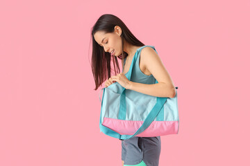 Sticker - Young woman with sports bag on pink background