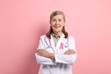 Poster - Mammologist with pink ribbon on color background. Breast cancer awareness