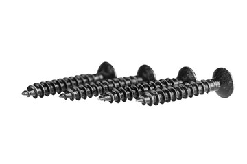 black wood screws on isolated white background close up