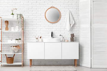 Poster - Modern sink with bath supplies on countertop near white brick wall in bathroom