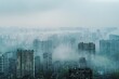 A cityscape dominated by tall buildings, shrouded in thick fog, creating an eerie urban atmosphere