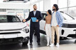© Prostock-studio - Car salesman discussing with indian couple