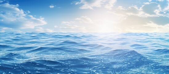 Wall Mural - the suns rays are filtering through the cumulus clouds, casting a golden glow over the water below, 