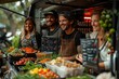 A community of smiling people gathers in front of a food truck at a market event, sharing whole foods and natural cuisine on ecofriendly tableware
