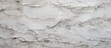 A Close Up Of A Grey Wall With Peeling Paint, Resembling A Snowy Landscape. The Wood Flooring Underneath Shows Through, Creating A Unique Pattern