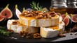 Camembert cheese with honey and walnuts on a black background