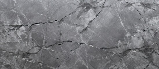 Wall Mural - A close up of a gray marble texture resembling water ripples on a calm pond. The monochrome photography captures the intricate details of the landscape