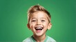 young white child boy on plain bright green background laughing hysterically looking at camera background banner template ad marketing concept from Generative AI