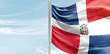 Dominican Republic national flag with mast at light blue sky.