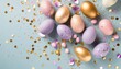 top view photo of easter decorations multicolored easter eggs gold pink and violet confetti on isolated pastel blue background