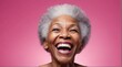 young black african elderly woman on plain bright pink background laughing hysterically looking at camera background banner template ad marketing concept from Generative AI