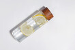 Stylish reusable bottle with lemon infused water isolated on white