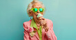 Stylish senior lady enjoying a colorful ice cream, perfect for fashion and lifestyle marketing campaigns or senior health and vitality themes