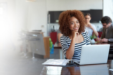 Leinwandbilder - Portrait, laptop and happy business woman at table in office for creative career or job in startup. Face, computer and African professional entrepreneur, employee or confident copywriter thinking