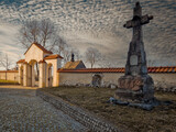 Fototapeta Mosty linowy / wiszący - Historic buildings of the church and village in Tum, Poland.