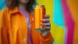 © Obsidian - Closeup of a soda can in the hand of a young woman.