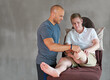 © peopleimages.com - Physio, patient with disability or leg in therapy, training or assessment in professional healthcare. Therapist, man or hospital bed in progress, exam or advice as medical, orthopedic or recovery