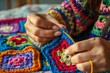 lady crocheting colorful granny squares for a quilt