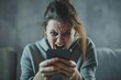 a young women staring at smartphone screen with angry face expression, get awful news in notice from bank, bad message, scam, fraud