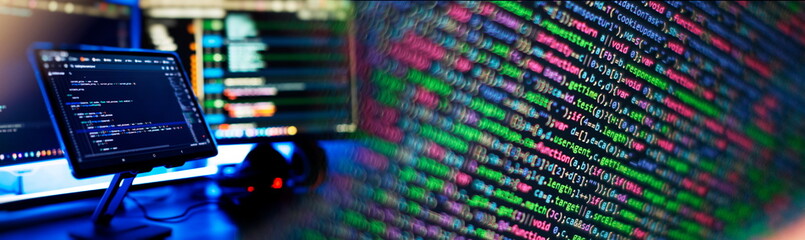 Working atmosphere of a programmer at home, background. Programming code abstract screen