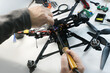 Engineer solders and assembles fpv drone