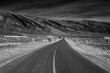 Infrared black and white photography of asphalt road to Foumz Guid in Morocco. 850 nm filter