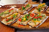 Fototapeta  - Sandwiches made of home-made bread with lard, cucumber, chives and peppers at a stall during a fair in polish countryside