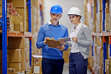 Poster - Warehouse, man and woman with tablet, distribution and inspecting inventory with cooperation. Supply chain, supervisor and management with technology and update schedule with import and industrial