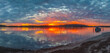 Sunrise over the bay water with clouds and reflections