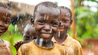 © Yuwarin - Group of happy African children in the rain on the village background.