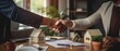 © Umme - Handshake shared between a real estate agent and client