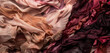 : A vividly detailed photograph of an abstract composition featuring palette painting with deep maroon and soft peach textiles heavily layered.