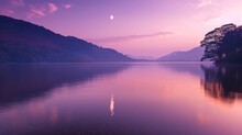 A Serene Twilight Scene Over Lake Windermere In The Beautiful Lake District, With A Purple Sky