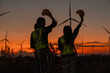 Engineer and energy farming. Wind turbine with the silhouette of sunset background.