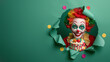 A cheerful clown with a vibrant red, yellow, green wig and makeup, peeking through a ripped green paper background with confetti