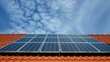 Solar panels on a house roof against a blue sky