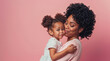 © OpticalDesign - African american mom and daughter hugging on a pastel pink background, mother and girl happy with copyspace hd