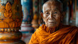 Portrait of an old Buddhist monk, in the Asian temple, his face is wrinkled. 