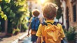 Two children walking down a sunlit street one with a blue backpack and the other with a yellow one enjoying a day out.