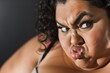 closeup on a plussize dancers expression during a difficult move