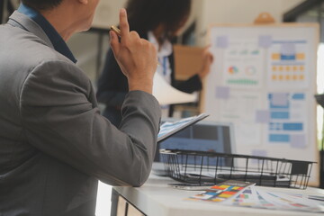 Close up ux developer and ui designer use augmented reality brainstorming about mobile app interface wireframe design on desk at modern office.Creative digital development agency
