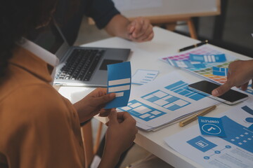 Close up ux developer and ui designer use augmented reality brainstorming about mobile app interface wireframe design on desk at modern office.Creative digital development agency