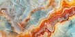 Onyx marble is a translucent stone with a striking appearance, featuring a colorful and vibrant base with swirling patterns and veins of contrasting hues